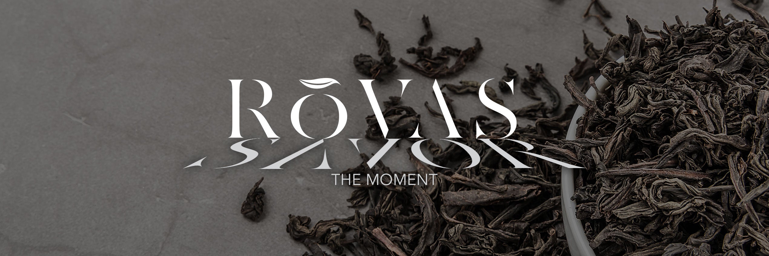 Rovas Tea - Savor The Moment | Rovas logo laid over the top of loose leaf tea